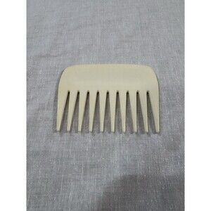vintage unbranded cream-colored plastic hair comb 4”L X 3”W